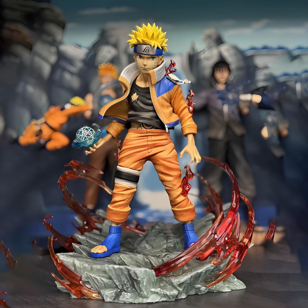 Naruto figurines, including the final battle scene from the Valley of the End, featuring Naruto as a statue, model, and anime character.Naruto figurines, including the final battle scene from the Valley of the End, featuring Naruto as a statue