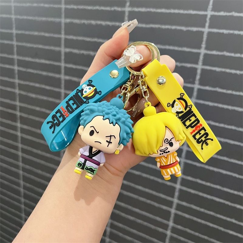 Creative cartoon One Piece keychains featuring Luffy, Chopper, Zoro, Sanji, and Law – cute keychains and bag charms for men and women.