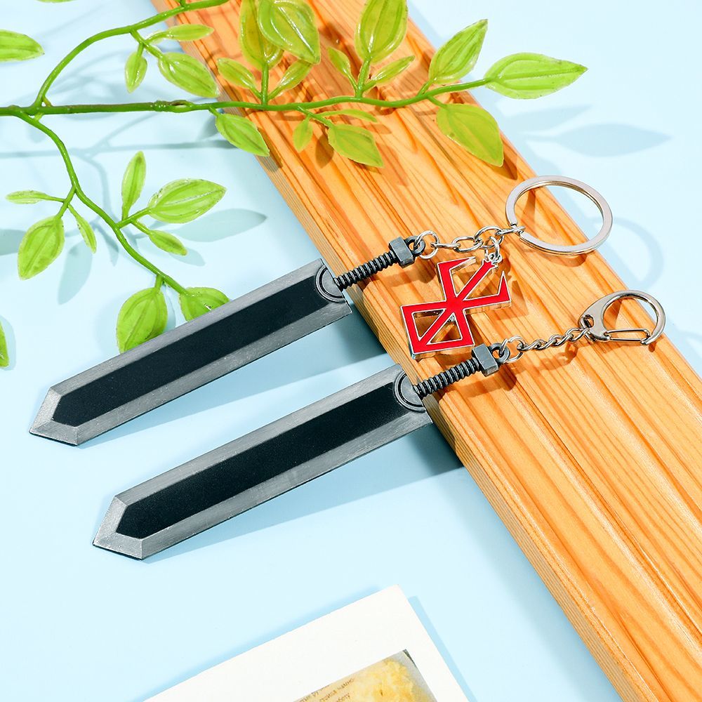 Berserk keychain, red and black, featuring the Black Swordsman Guts' weapon, a decorative pendant.