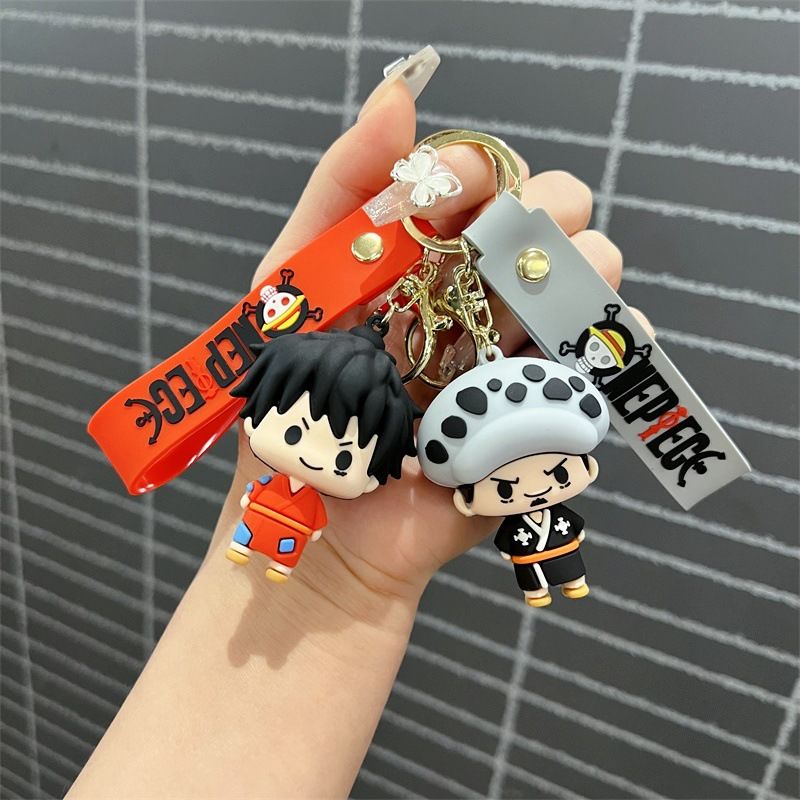 Creative cartoon One Piece keychains featuring Luffy, Chopper, Zoro, Sanji, and Law – cute keychains and bag charms for men and women.