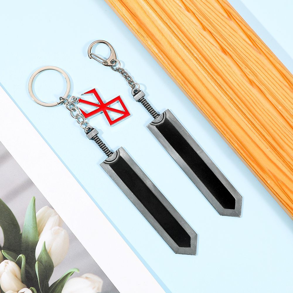 Berserk keychain, red and black, featuring the Black Swordsman Guts' weapon, a decorative pendant.